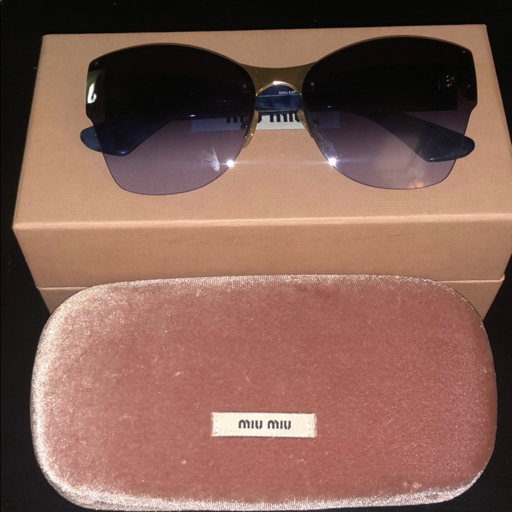 Miu Miu sunglasses in “like new” condition.